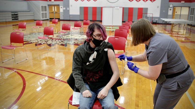 Stebbins High School sophomore, Ryan Riesenbeck gets a COVID-19 shot by Sinclair College nursing student Sarah Mills Wednesday April 28, 2021.


waits for 15 minutes after he received a COVID-19 vaccination at the school Wednesday April 28, 2021. JIM NOELKER/STAFF