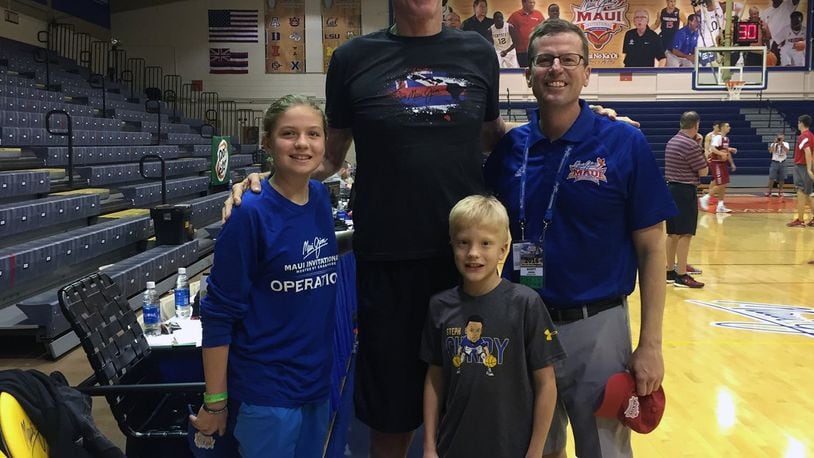 Scott Janess (right) with his children, Camron (front) and Mara (left), and ESPN analyst Bill Walton (middle) at the 2016 Maui Jim Maui Invitational. CONTRIBUTED
