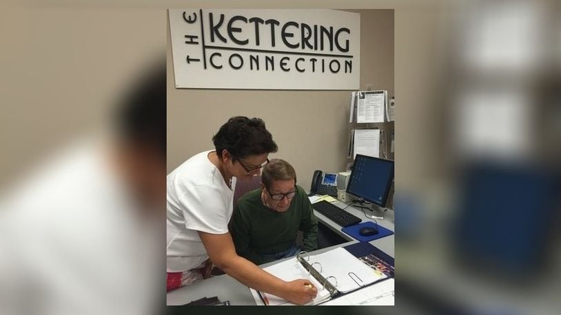 Vickie Carraher, Kettering senior services coordinator helps out a senior Kettering resident. CONTRIBUTED