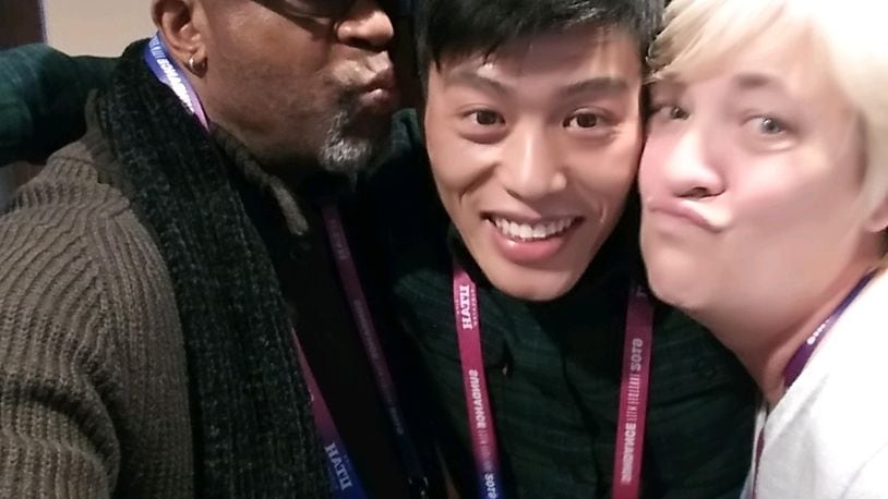 Robert "Bobby" Allen, Wong He and Jill Lamantia pose for a selfie.  The trio appears in Julia Reichert and Steven Bognar's "American Factory" and are featured on a poster for it.