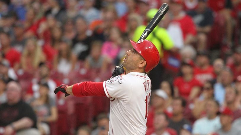 The Reds' Joey Votto hits a grand slam in the third inning against the Tigers on Tuesday, June 19, 2018, at Great American Ball Park in Cincinnati.