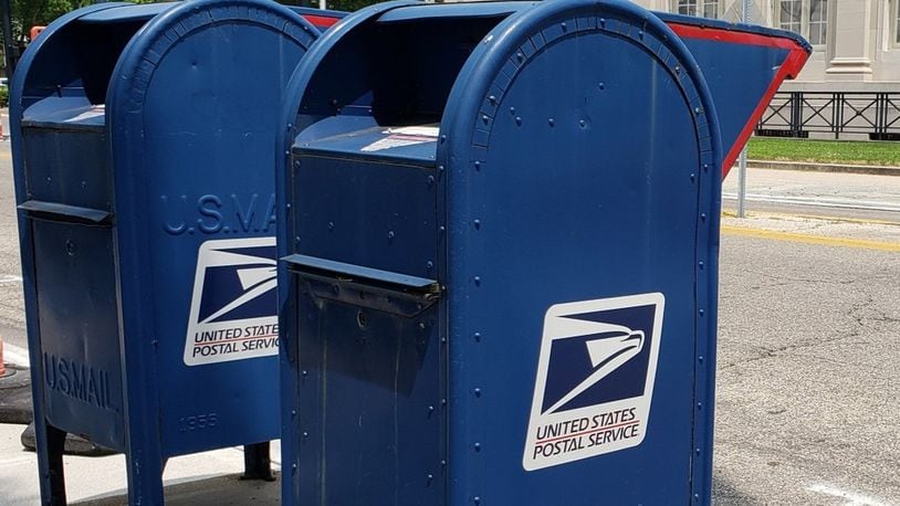 Letter carriers in Dayton and Trotwood were robbed at gunpoint Thursday, Sept. 22, 2022, each by a gunman demanding the "arrow key," which is a universal key that unlocks the blue collection mailboxes. The robberies are under investigation by the U.S. Postal Inspection Service in Cincinnati. NICK GRAHAM/STAFF FILE