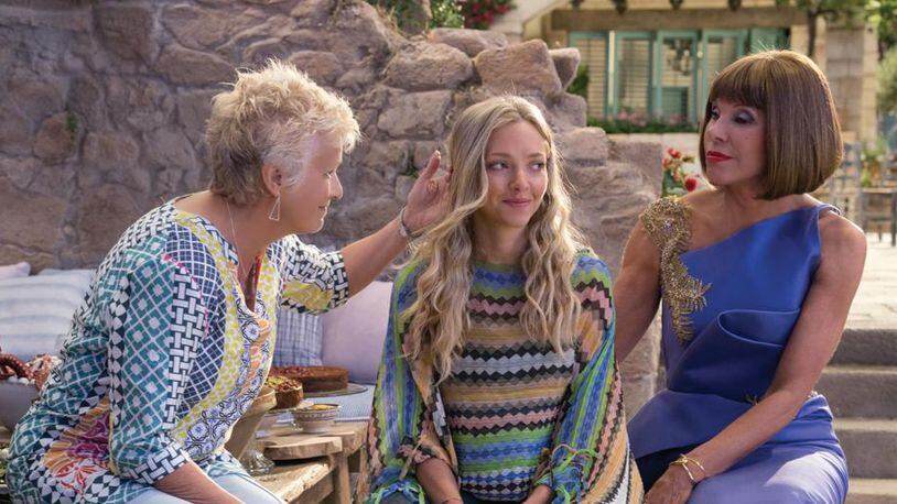 (L to R) Rosie (JULIE WALTERS), Sophie (AMANDA SEYFRIED) and Tanya (CHRISTINE BARANSKI) in "Mamma Mia! Here We Go Again."  Ten years after "Mamma Mia! The Movie," you are invited to return to the magical Greek island of Kalokairi in an all-new original musical based on the songs of ABBA.