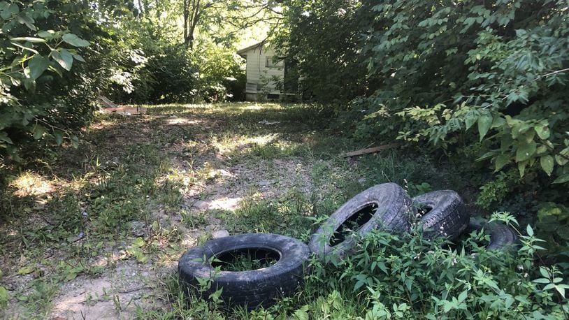 Tires dumped in an alley in West Dayton. CORNELIUS FROLIK / STAFF