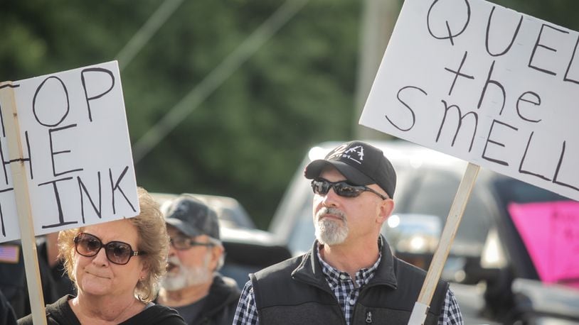 About 30 residents from Bath Twp. and eastern Fairborn gathered Wednesday evening, May 5, 2021, in front of the Bath Twp. Administration building to protest the Dovetail Energy biodigester on Herr Road. JIM NOELKER/STAFF