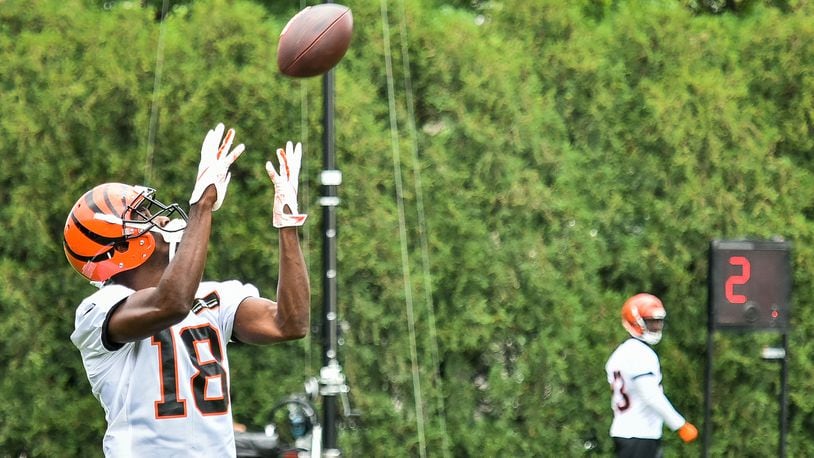 Bengals’ wide receiver A.J. Green catches a pass during organized team activities Tuesday, May 22 at the practice facility near Paul Brown Stadium in Cincinnati. NICK GRAHAM/STAFF