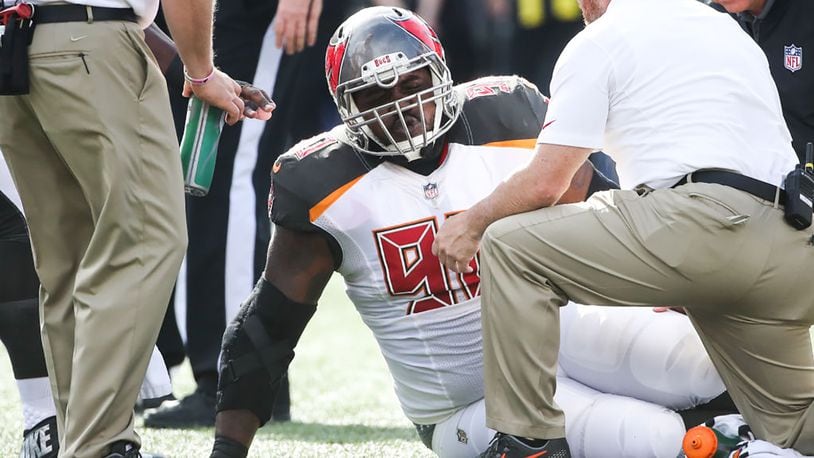 ORCHARD PARK, NY - OCTOBER 22: Chris Baker #90 of the Tampa Bay Buccaneers sits on the field after being injured during the second quarter of an NFL game against the Buffalo Bills on October 22, 2017 at New Era Field in Orchard Park, New York. (Photo by Tom Szczerbowski/Getty Images)