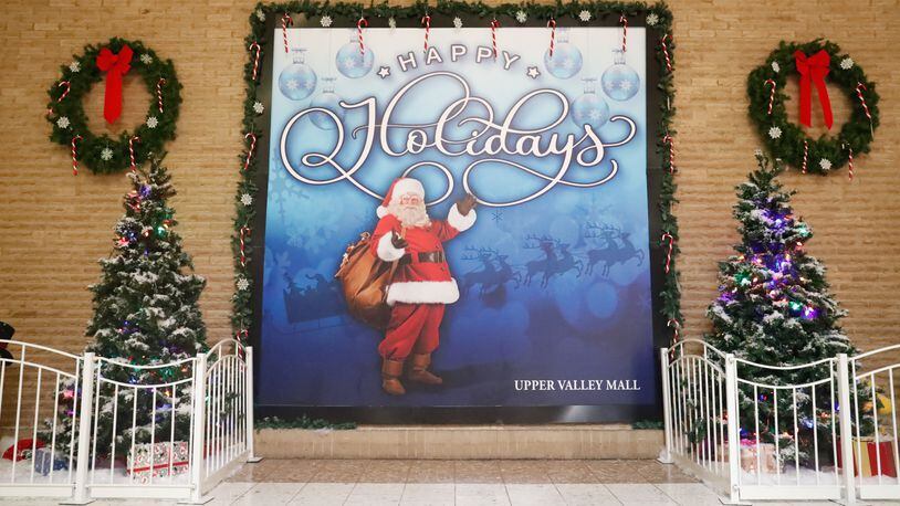 Due to the COVID-19 pandemic, photos with Santa Claus will not be available for purchase at the Upper Valley Mall this year. Instead, residents will be able to come to the Mall to get a free selfie at the Santa Selfie Wall, located behind the Christmas Tree. Contributed