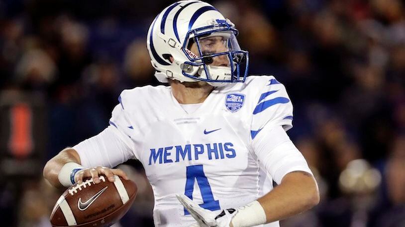 Memphis quarterback Riley Ferguson throws to a receiver in the second half of an NCAA college football game against Navy in Annapolis, Md., Saturday, Oct. 22, 2016. Navy won 42-28. (AP Photo/Patrick Semansky)