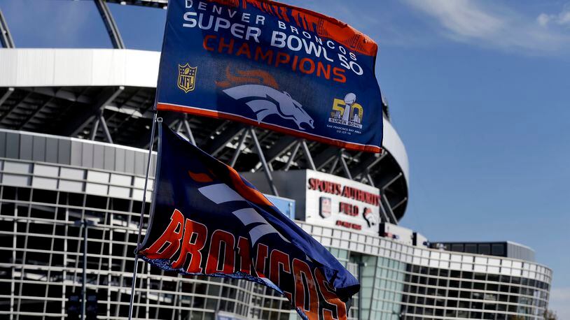 Flags fly outside Mile High Stadium prior to an NFL football game between the Houston Texans and the Denver Broncos, Monday, Oct. 24, 2016, in Denver. (AP Photo/Jack Dempsey)