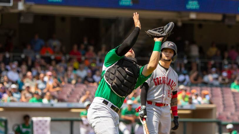 Dragons catcher Eric Yang catches a foul popup in the third inning Sunday off the bat of Great Lakes batter Andy Pages. Jeff Gilbert/CONTRIBUTED