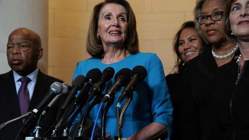 U.S. House Minority Leader Rep. Nancy Pelosi, D-Calif., speaks to members of the media along with other members of the House Democratic caucus. Rep. Joyce Beatty, D-Ohio, is second from the right. (Photo by Alex Wong/Getty Images)