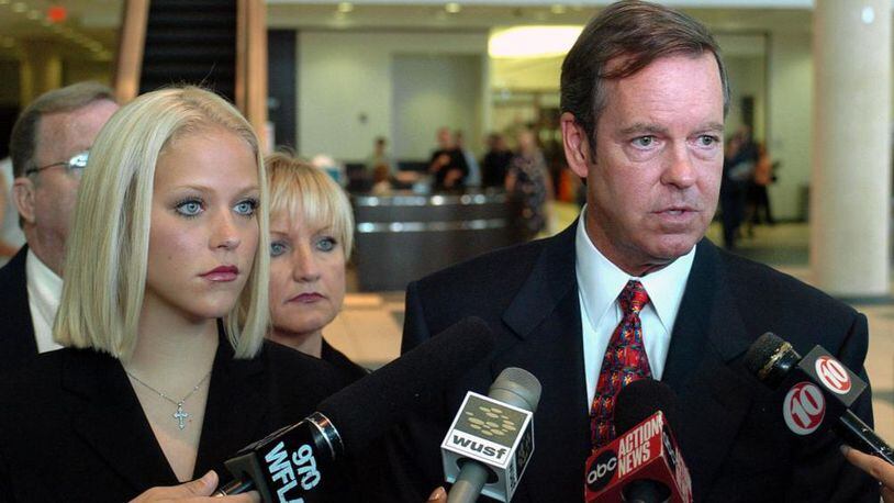 Former middle school teacher Debra Lafave, 24, left, stands with her attorney John Fitzgibbons, right, as he talks with reporters after a hearing before Circuit Court Judge Wayne Timmerman Monday, July 18, 2005 at the Hillsborough County Courthouse in Tampa, Fla. Lafave, whose sexual liaisons with a 14-year-old student made tabloid headlines, broke off plea negotiations with prosecutors and will claim insanity at a December trial, her attorney said Monday.(AP Photo/Steve Nesius)