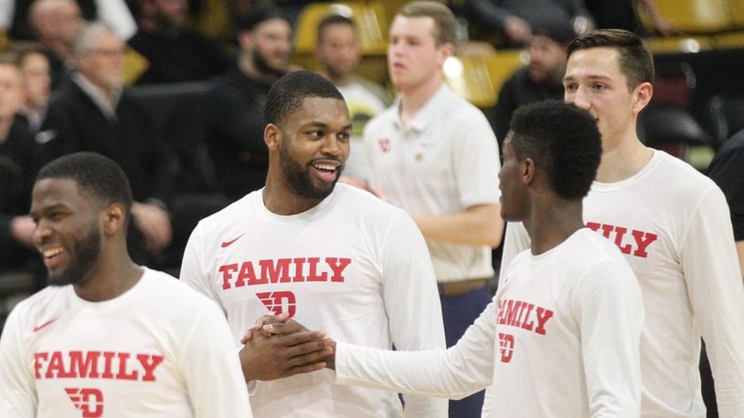 Dayton’s Trey Landers and Dwayne Cohill shake hands before a NIT game against Colorado on Tuesday, March 19, 2019, at the CU Events Center in Boulder, Colo. David Jablonski/Staff