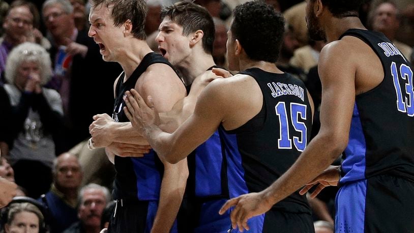 Duke’s Luke Kennard, left, and Duke’s Grayson Allen, second from left, celebrate with teammates after Kennard’s game-winning basket against Wake Forest in the second half of an NCAA basketball game in Winston-Salem, N.C., Saturday, Jan. 28, 2017. Duke won 85-83. (AP Photo/Chuck Burton)