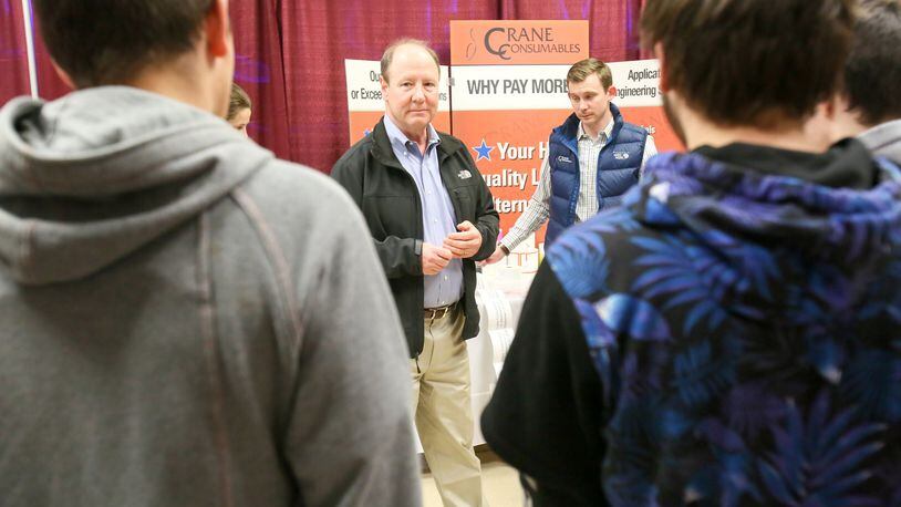 Robert Crane of Crane Consumables talks to students from Edgewood High School about careers with his company during a Career Showcase as part of the the Chamber of Commerce serving Middletown, Monroe & Trenton All American Business & Careers Expo, Thursday, March 23 at Miami University Middletown. GREG LYNCH / STAFF
