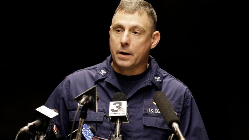Capt. Michael Mullen of the U.S. Coast Guard answers questions during a news conference at Burke Lakefront Airport, Friday, Dec. 30, 2016, in Cleveland. The U.S. Coast Guard says there's been no sign of debris or those aboard a plane that took off from the airport on the shores of Lake Erie and went missing overnight. (AP Photo/Tony Dejak)
