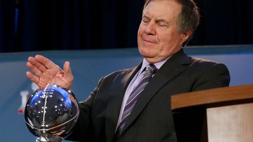 HOUSTON, TX - FEBRUARY 06: Head coach Bill Belichick of the New England Patriots pats The Vince Lombardi at the Super Bowl Winner and MVP press conference on February 6, 2017 in Houston, Texas. (Photo by Bob Levey/Getty Images)