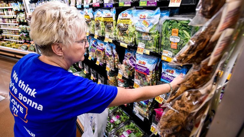 Carol Spencer collects an online grocery order for the Clicklist store pickup at Kroger Marketplace. Customers can order their groceries online and pay and get their order loaded into their car by Kroger staff. NICK GRAHAM/STAFF