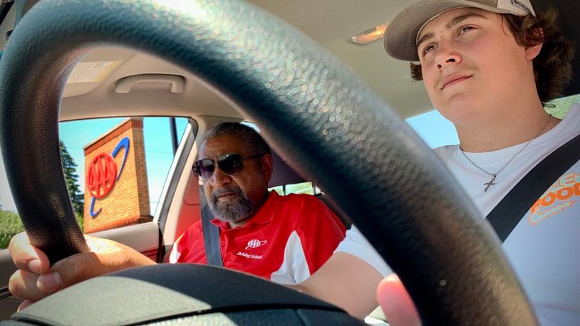 AAA driving school instructor Guy Jones, left, with student driver Zach Lehman, 16, as they head out for an on-road session Tuesday May 31, 2022. MARSHALL GORBY\STAFF
