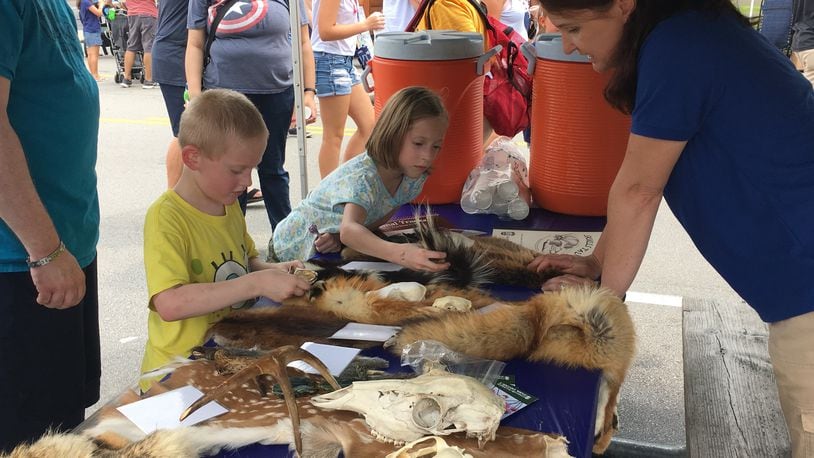 The park district had a hands-on learning booth for kids at the Americana Festival. Thousands attended the Centerville Washington Township Americana Festival, Thursday, a local 4th of July tradition. KATIE WEDELL/STAFF
