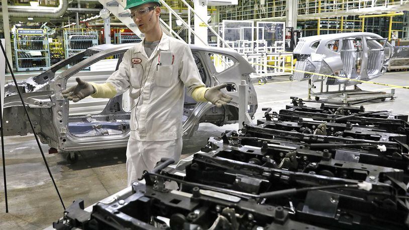 Scott King explains how the new component front end attaches to the new frame of the 2017 Honda CRV at the company’s East Liberty manufacturing plant. Honda will invest $124 million to build a new wind tunnel in East Liberty. Bill Lackey/Staff