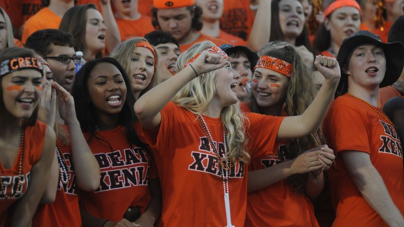 Members of the Beavercreek cheering section do what they do best. Beavercreek defeated visiting Xenia 37-20 in a high school football season opener on Thursday, Aug. 25, 2016. MARC PENDLETON / STAFF