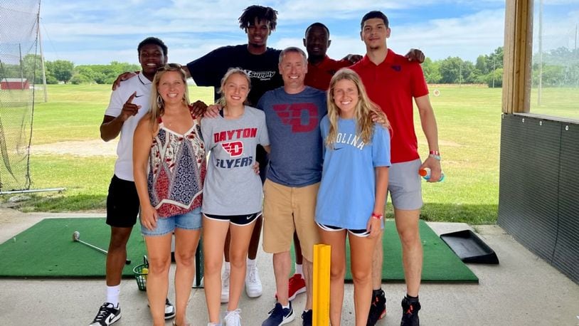Dayton basketball players (left to right in back) Malachi Smith, DaRon Holmes II, R.J. Blakney and Koby Brea pose for a photo with fans at Young's Jersey Dairy in June 2022 in Yellow Springs. Contributed photo