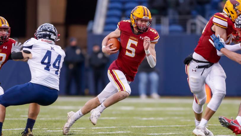 New Bremen High School senior quarterback David Homan runs the ball during the Division VII state title game against Warren JFK on Saturday, Dec 3 at Tom Benson Hall of Fame Stadium in Canton. The Cardinals won 38-6. CONTRIBUTED PHOTO BY MICHAEL COOPER