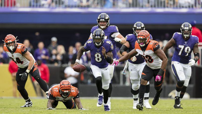 BALTIMORE, MD - OCTOBER 13: Lamar Jackson #8 of the Baltimore Ravens scrambles against the Cincinnati Bengals during the first half at M&T Bank Stadium on October 13, 2019 in Baltimore, Maryland. (Photo by Scott Taetsch/Getty Images)