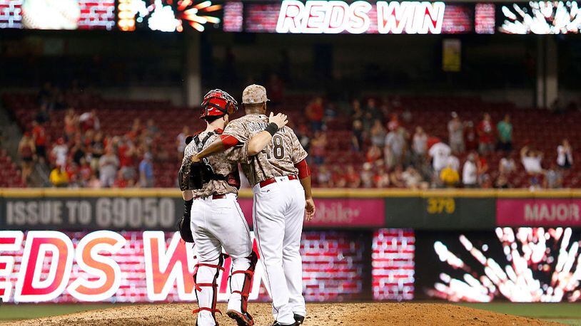 CINCINNATI, OH - AUGUST 19: Tucker Barnhart #16 of the Cincinnati Reds and Keyvius Sampson #48 of the Cincinnati Reds congratulate each other after defeating the Los Angeles Dodgers 9-2 at Great American Ball Park on August 19, 2016 in Cincinnati, Ohio. (Photo by Kirk Irwin/Getty Images)