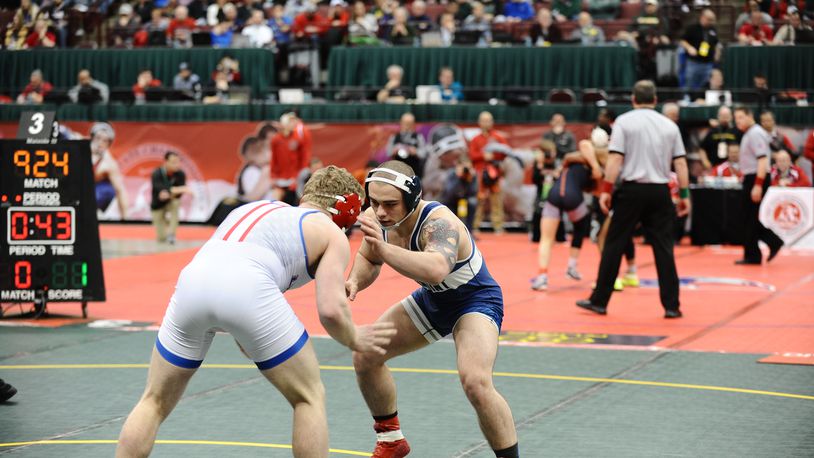 Fairmont junior Nevan Snodgrass gave Powell Olentangy Liberty senior Carson Karchla a challenge in the Division I state semifinals at 170 pounds Friday. Karchla, the defending state champ at 170 and ranked No. 1 in the nation by Intermat, won 5-1. Snodgrass can finish as high as third Saturday. Greg Billing / CONTRIBUTED