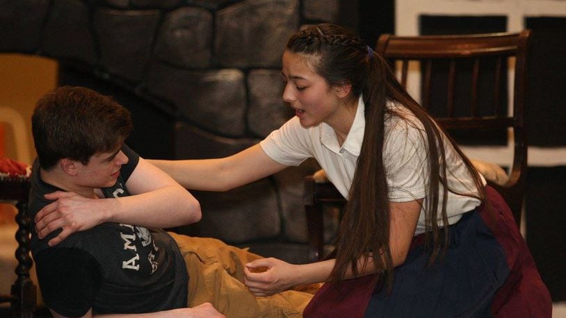 David Shockey (Beast) and Emi Ford (Belle) rehearse a tender moment in Children s Performing Arts of Miamisburg’s production of Disney’s Beauty and the Beast, slated for May 5-13 at Memorial Auditorium. CONTRIBUTED