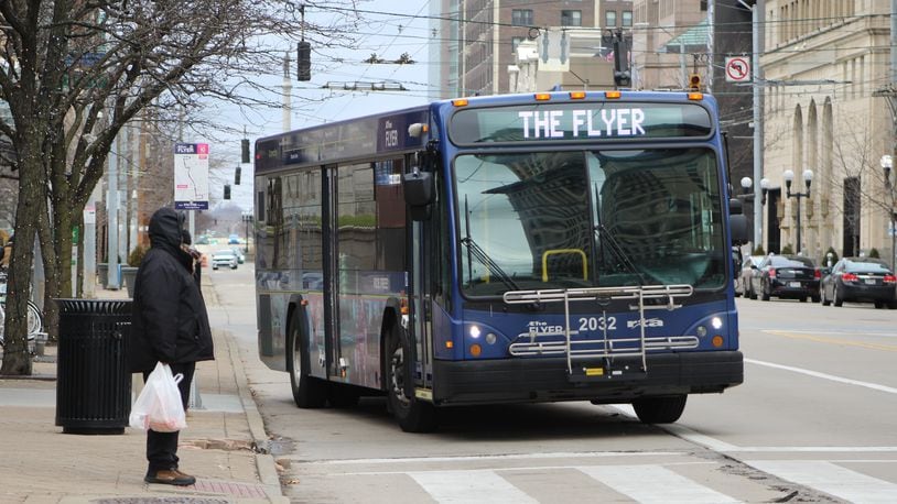 The free Flyer shuttle bus travels along South Main Street in downtown Dayton on Friday. CORNELIUS FROLIK / STAFF