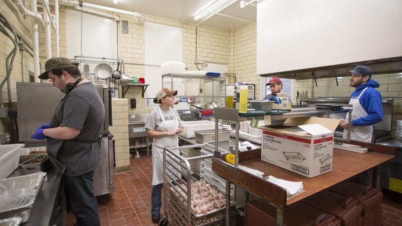 The school’s nutrition team works out of the kitchen at the middle school building in Ormewood Park. Meals are prepped there, then either served in the middle school cafeteria or delivered to the elementary school campus in Grant Park. (Photo: Kelley Klein Photo: For the AJC)